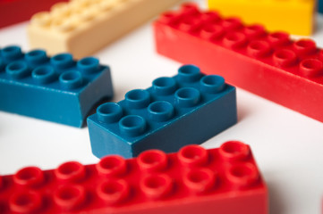 closeup of plastic bricks construction on white background