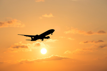 airplane taking off airport sky-diving industry cargo business, concept: passenger Commercial modern navigable Travel and business,Silhouette aircraft is flying above skyline sun