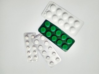 Few medicine pills pack on white background