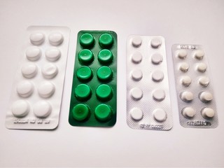 Few medicine pills pack on white background