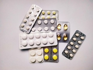 Few medicine pills pack on white background