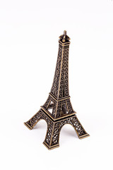 Fototapeta na wymiar Miniatur Eiffel Tower Paris isolated. Travel concept photo.