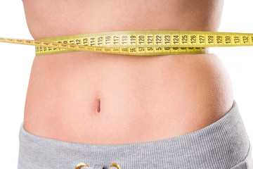 sport, fitness and diet concept, trained belly with measuring tape, health