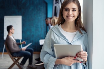 Portrait of smiling woman with tablet pc.