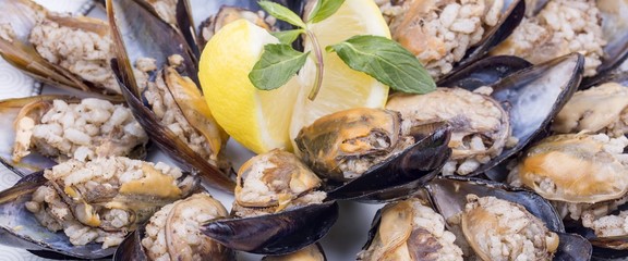 Traditional delicious Turkish style stuffed mussels. Food concept photo.