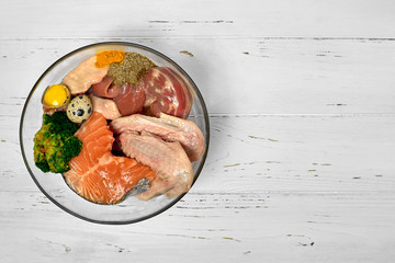 Natural raw dog food BARF diet as opposite of kibble dry food Concept Closeup