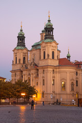 Fototapeta na wymiar Prague - The Staromestske square and baroque St. Nicholas church at dusk.