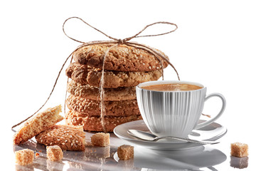 Composition white cup with coffee and oatmeal cookies. ?ane sugar. - 251396577