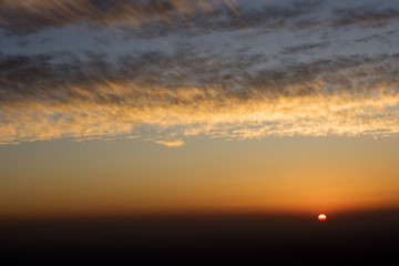 Fototapeta na wymiar Beautiful sunset on the top of Jabel Hafeet mountain, Al Ain city, UAE. Asia.