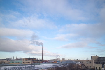 Obraz premium windy day over industrial city