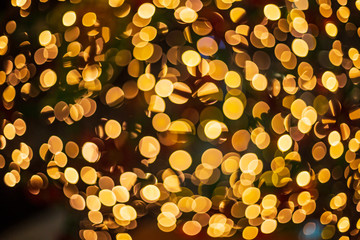 Defocused yellow lanterns on a black background bokeh