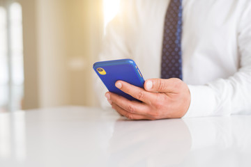 Close up of business man hands using smarpthone