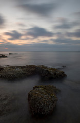 Fototapeta premium A sunrise by the sea in long exposure