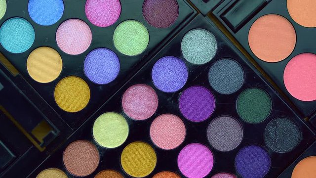 Multi Color Shiny eyeshadow and Rotating professional makeup eyeshadows palette for cosmetics 4K footage