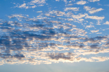 Beautiful celestial landscape. Clouds and sun at sunset. Clouds and sun at dawn. The radiance of the sunlight.