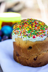 Plates with sweet Easter cake on table