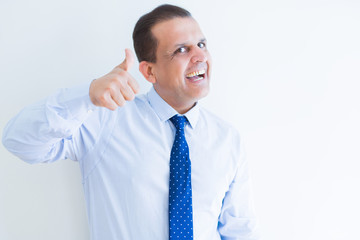 Middle age man doing postive gesture with thumbs up smiling to the camera