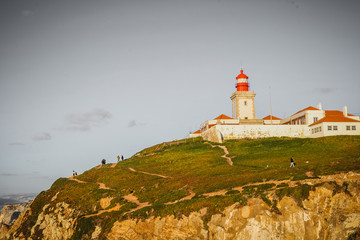 Fototapeta na wymiar Picturesque view of Cabo da Roca Lighthouse on hill at sunny day, Portugal