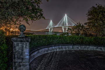 bridge at night with stone wall