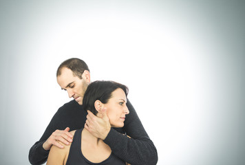 Physical therapist massaging a beautiful woman neck. Concept physiotherapy and osteopathy