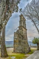 Inside view of medieval Montalegre castle, medieval tower bell, dramatic sky as background