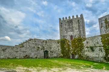 Fototapeta na wymiar Inside view of medieval Montalegre castle, dramatic sky as background