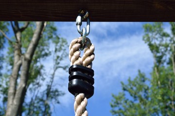 rope hangs on a metal bracket