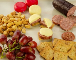 arrangements of Fruit, nuts, cheese, crackers, and meat