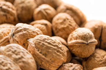 Whole walnuts background. Bunch of walnuts.