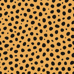 Cheetah animal print vector seamless pattern background it is a wild cat fur imitation in black and light orange colors in a polka dot look. Perfect for fabric, fashion, home decor, scrapbooking.