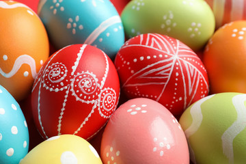 Fototapeta na wymiar Colorful decorated Easter eggs as background, closeup