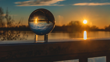 Crystal ball sunset shot with reflections at Plattling-Isar-Bavaria-Germany