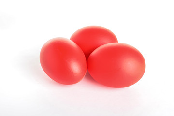 Red dyed Easter eggs on white background