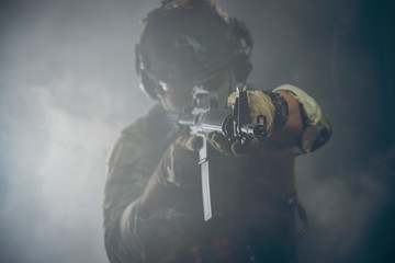 Spec ops police officer in black uniform on a studio background