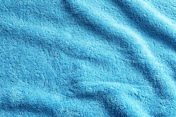 Obraz na płótnie Canvas Crumpled soft terry towel as background. Space for design