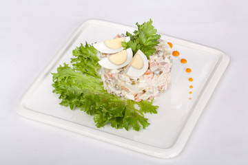  delicious Russian fresh salad with greens, on the table for use in culinary design