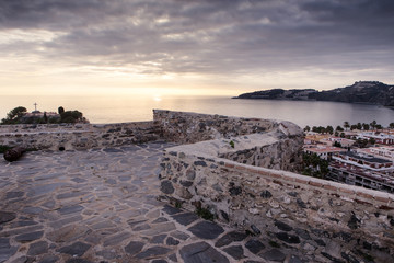 sunset looking out over the city of almunecar spain