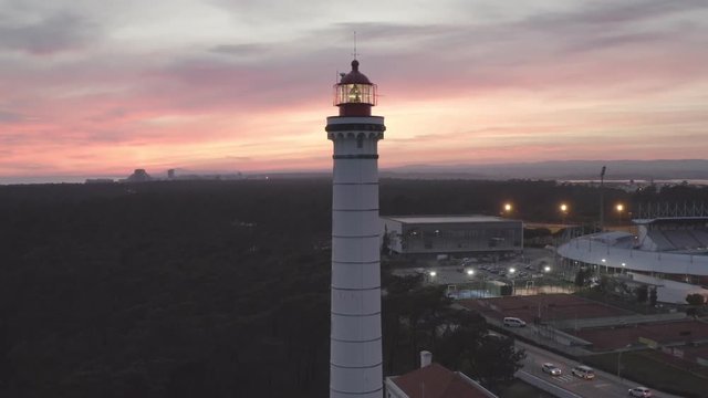 Aerial drone video of Vila Real de Santo Ant&oacute;nio city, lighthouse farol and stadium in Portugal, at sunset