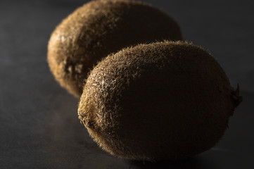 kiwi slices isolated on dark background