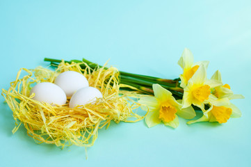 Easter decor or Spring card, spring flowers and eggs in the nest