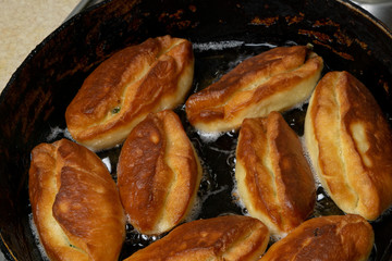 Patties roasting in a pan in sunflower oil