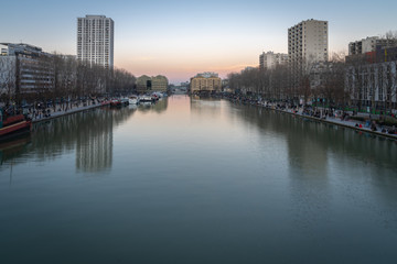 Fototapeta na wymiar Paris, France - 02 23 2019: View of the Basinof The Vilette at sunset
