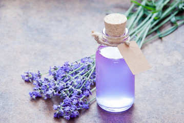 Aromatherapy oil and lavender, lavender spa, Wellness with lavender, lavender syrup on a wooden background