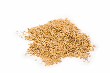 Pile of sesame seeds isolated on a white background