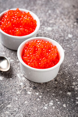Two bowls with red salmon caviar