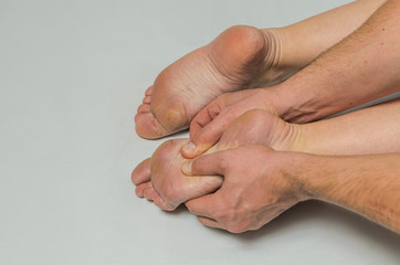 Fototapeta premium Hands massage therapist do foot massage