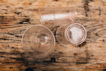 Empty plastic cups on wooden table