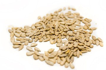 Pile of sunflower seeds isolated on white background