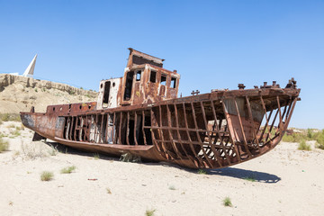 Rustic boats on a ship graveyards on a desert around Moynaq, Muynak or Moynoq - Aral sea or Aral...
