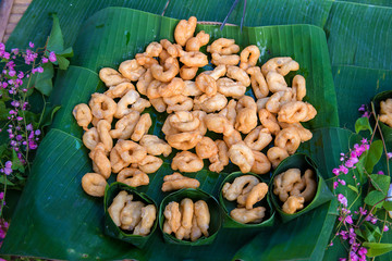Fototapeta premium Delicious Asia, Asian eating food. Frying mini Chinese Churros or Chinese Donut with soy milk for breakfast menu. ( Thai name is Patongko ). Chinese Doughnuts Popular breakfast served with soy milk.